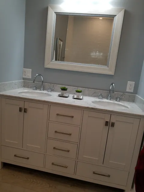 Bathroom vanity with mirror lighting and GFCI outlets