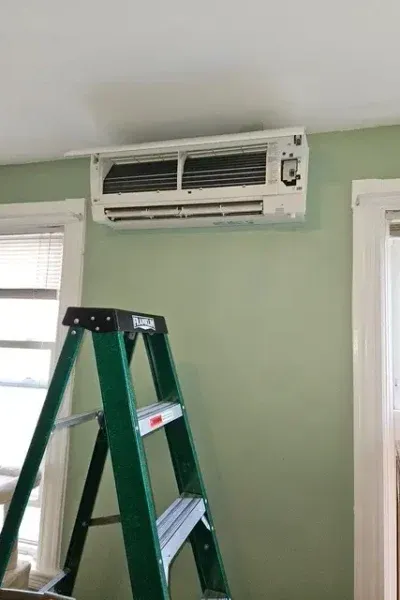 Wall-mounted air conditioner with ladder
