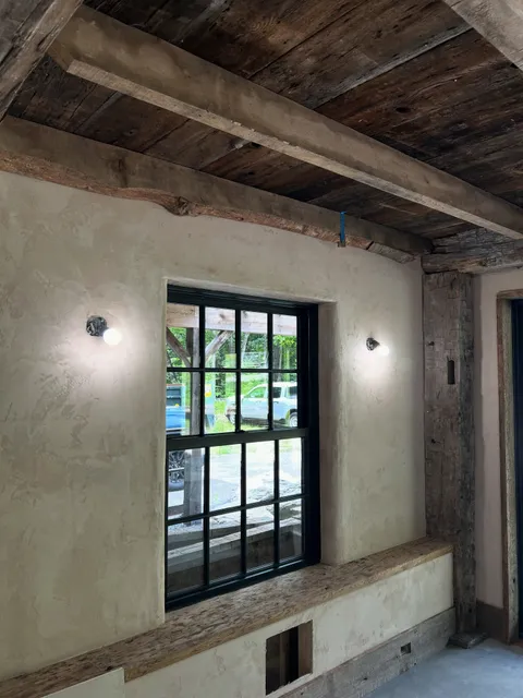 Crafting customs corners to tie together this old world looking tinted plaster finish to perfectly complement this space.