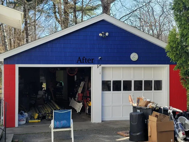 A freshly painted garage in Worcester, MA, featuring a bold red, white, and blue color scheme by Impeccable Painting.