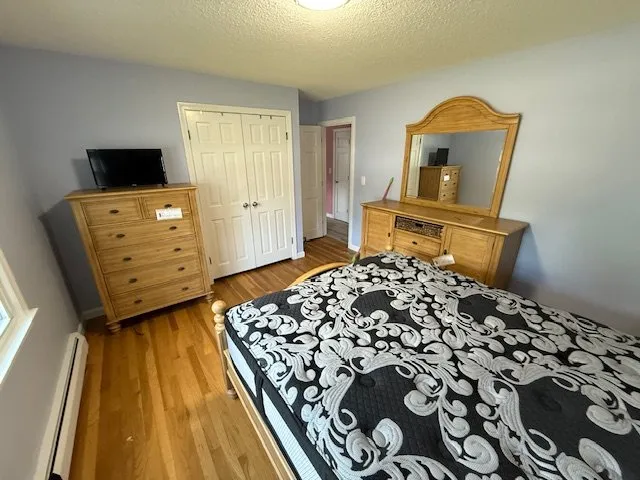 Assembled bedroom set including dresser, chest and bed frame