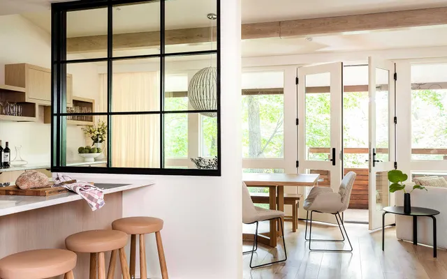 A view of a kitchen and dining room from the living room
