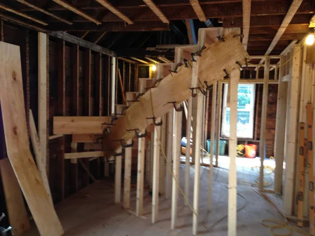 Custom curved staircase during construction