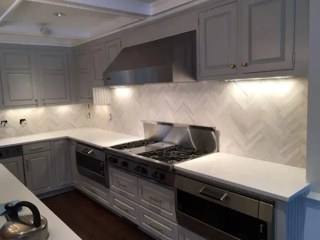 Marble Herringbone Pattern in Darien CT — Sophisticated white marble in classic herringbone layout