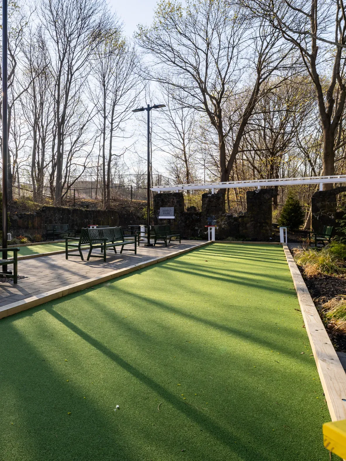 Price Landscape and Construction finished job site of an outdoor bocce ball court