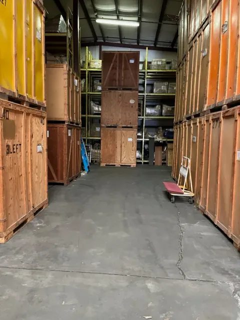 Rows of wooden storage vaults stacked inside the Murray's Moving & Storage warehouse