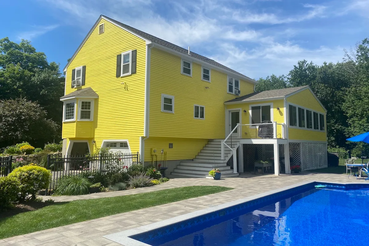Millis Massachusetts colonial painted yellow exterior