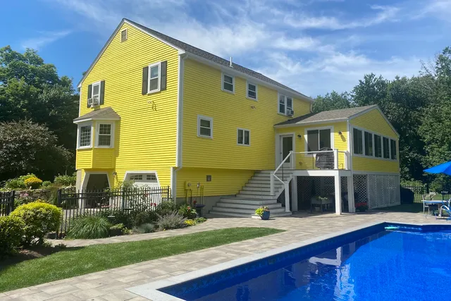 Millis Massachusetts colonial painted yellow exterior
