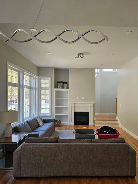 Open living room with fireplace and built-ins