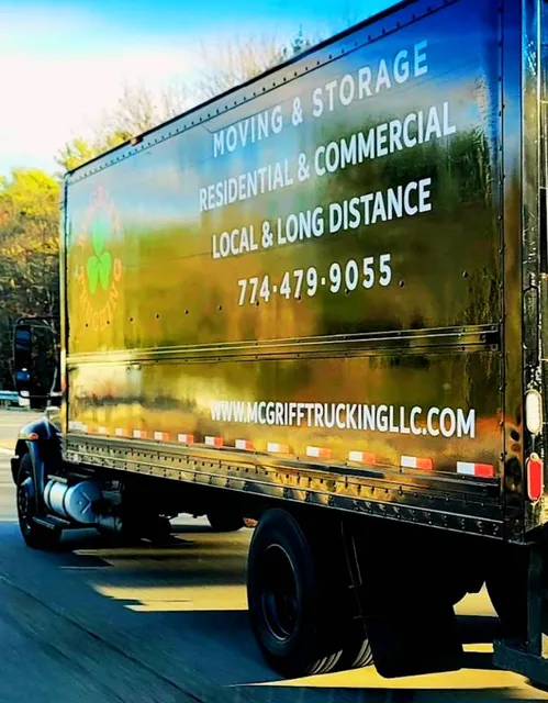 Photo of a large moving truck on the highway.