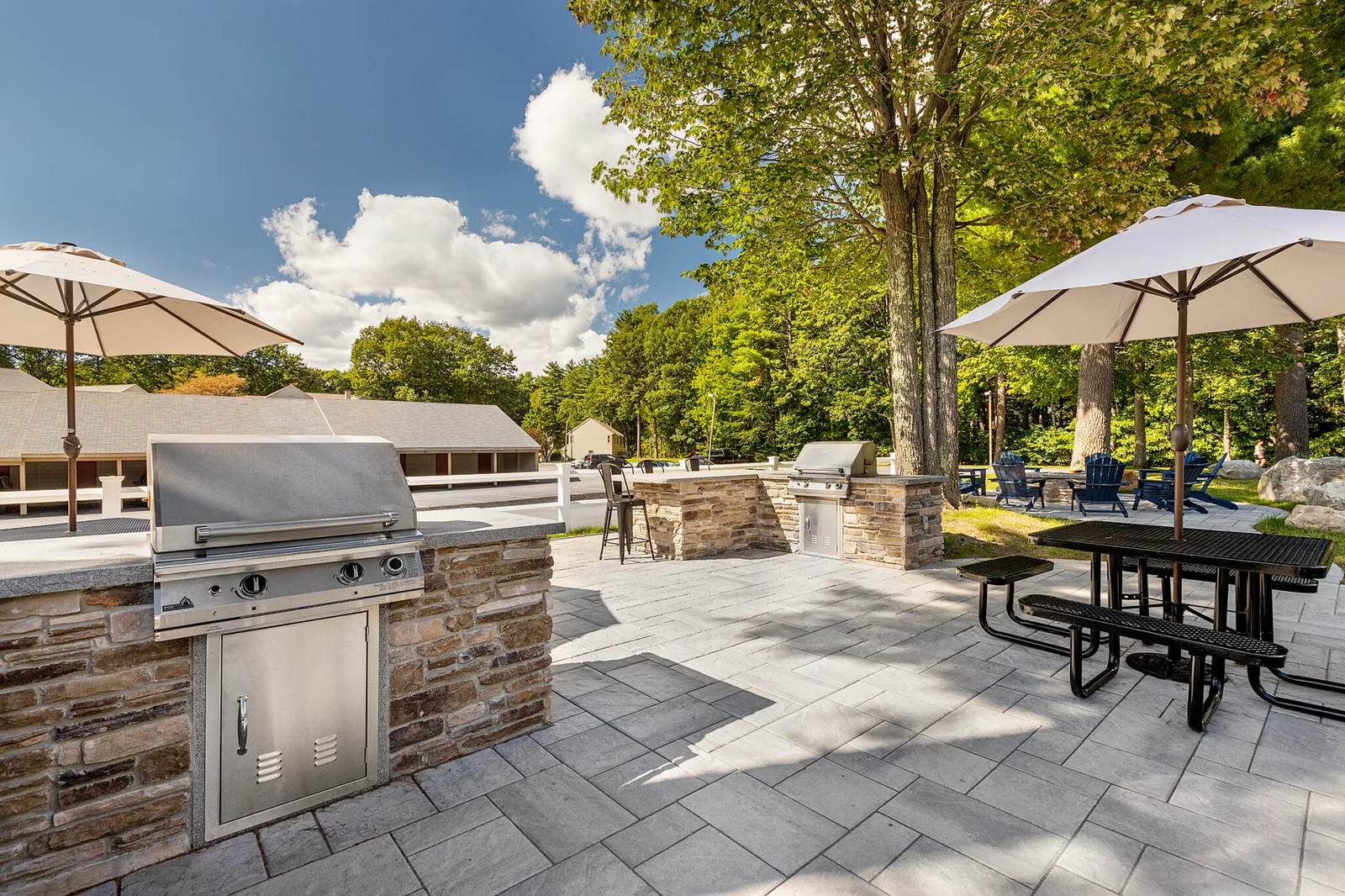 Recreation patio with outdoor kitchens. Commercial Landscape Design & Build Project at Cranmore Ridge in Concord, MA.