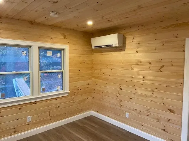 Light wood walls with white trim