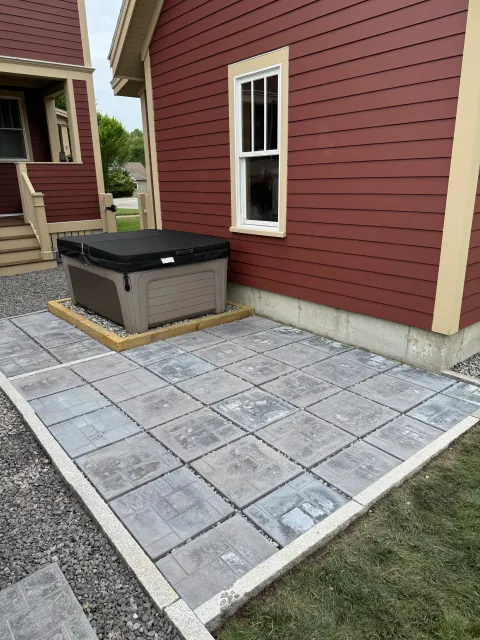 Paver slab patio installation in backyard