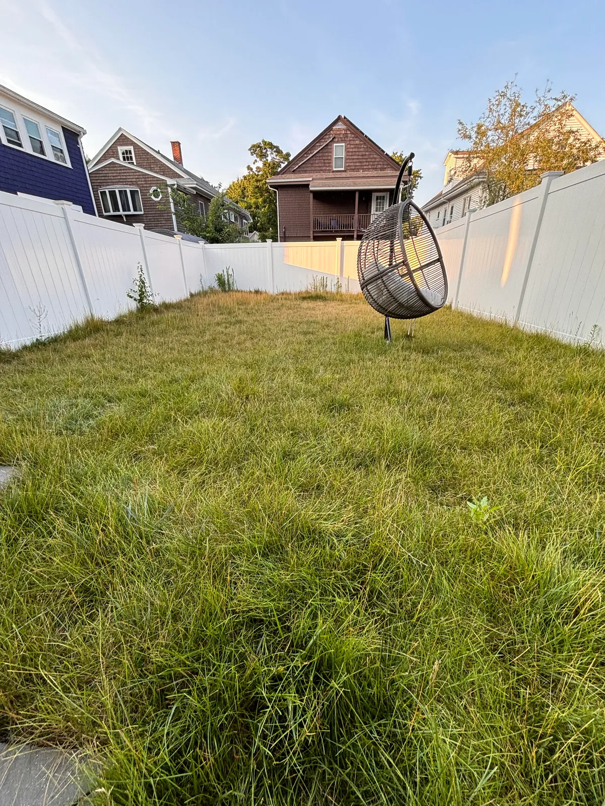 Before fall cleanup service in Arlington MA backyard