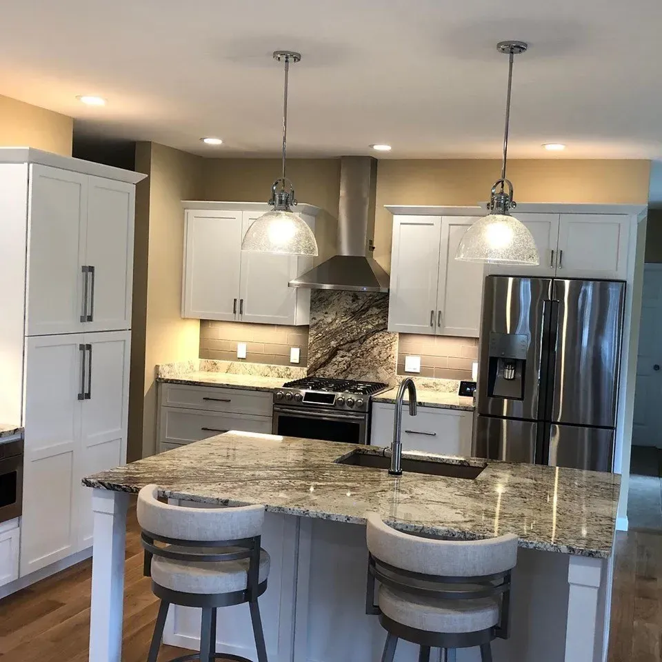A kitchen with stainless steel appliances and granite counter tops