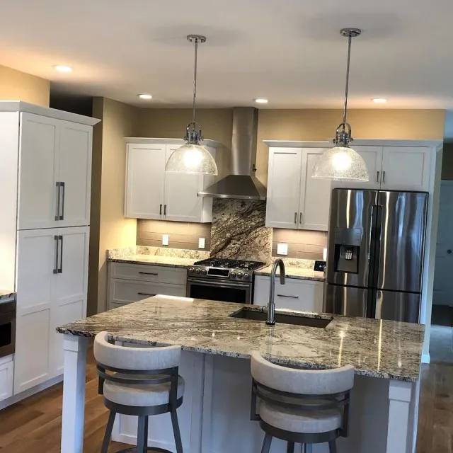 A kitchen with stainless steel appliances and granite counter tops