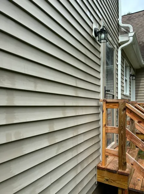 Vinyl siding in Worcester County, MA after lichen removal by soft washing — Pro Pressure Washing
