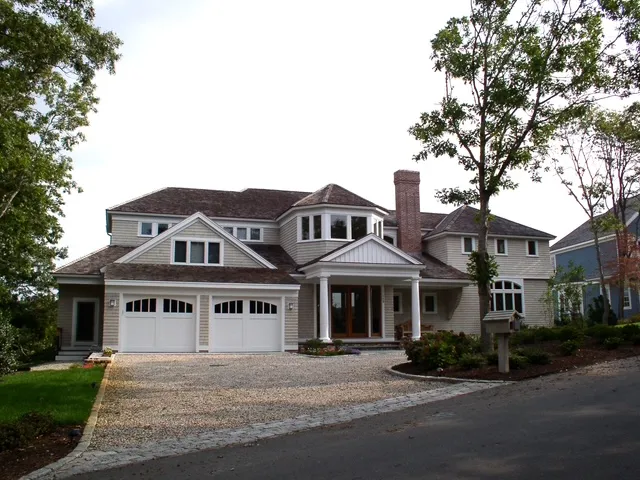 Classic New England shingle home with gravel drive built by Chilton Development