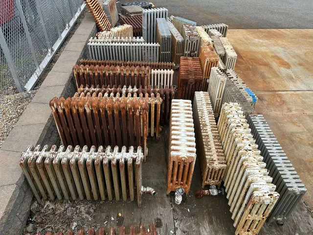 Cast iron radiators staged for a heating job