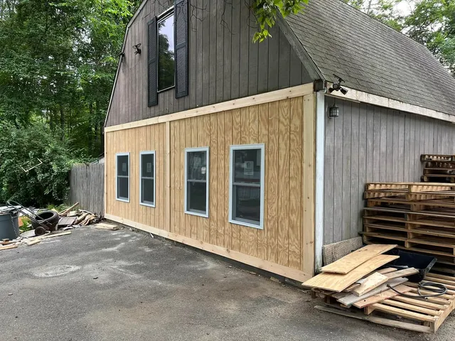 Barn exterior with new siding and window installation