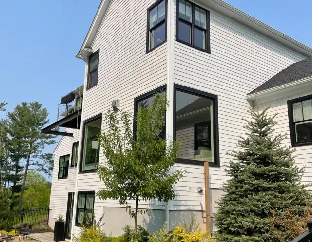 Freshly painted white home with black trim
