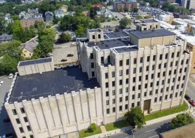 Aerial view of a flat commercial roof in Worcester, MA after a Carlisle EPDM roof replacement completed by Tech Roofing.