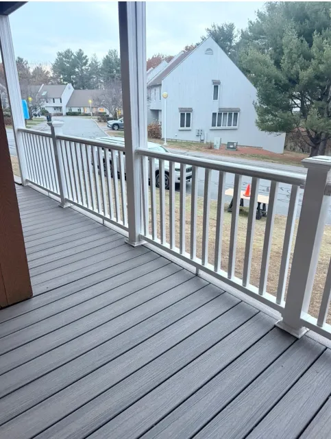 View of new Trex Enhance composite decking and vinyl hand rails installed by A+ Exteriors.