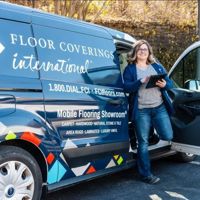 Employee standing in front of van