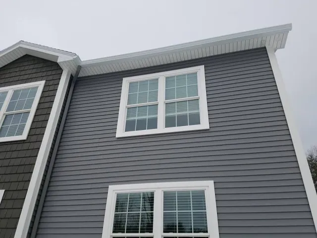 Seamless gutters on dormer windows