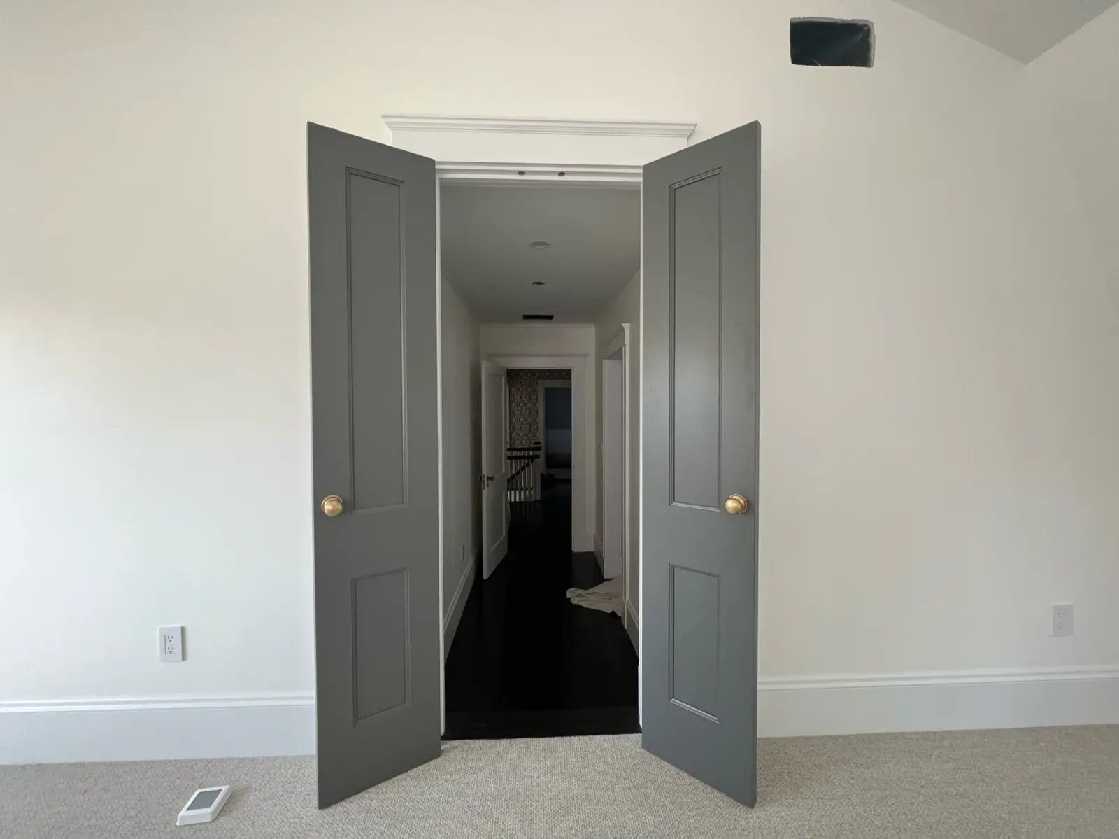 Finished gray double doors with white trim by Gallagher Painting