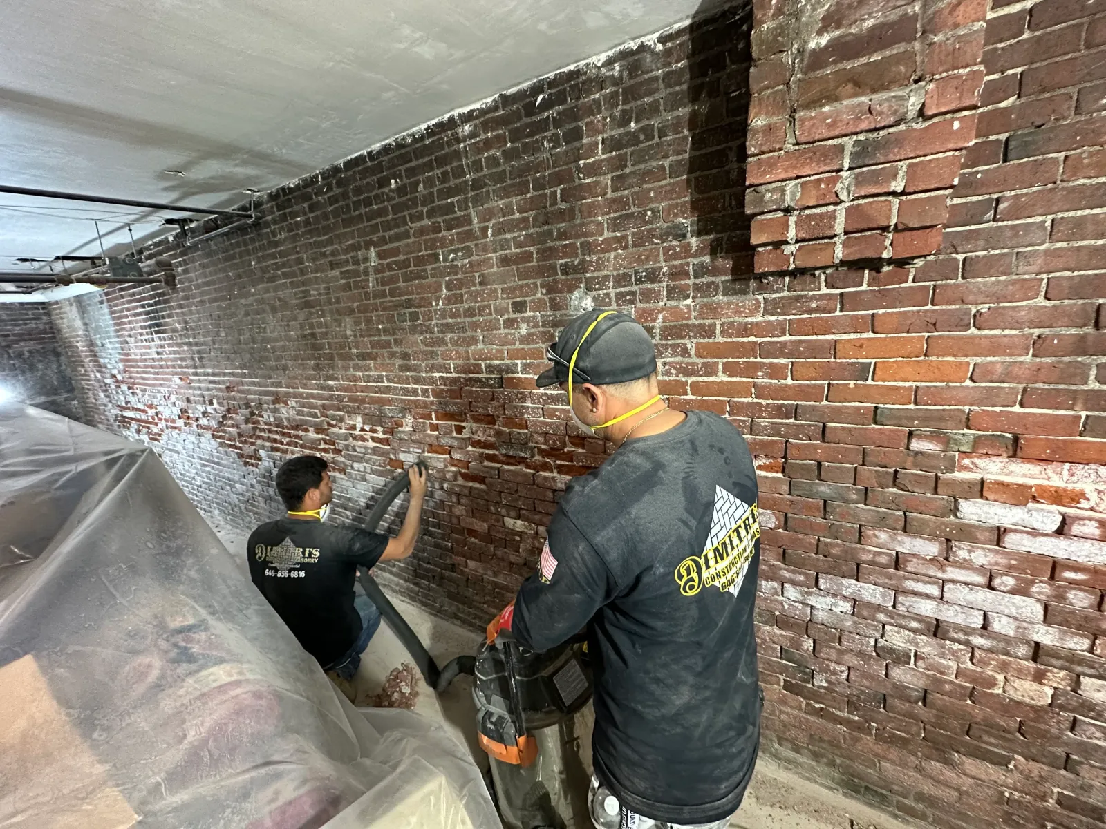 Repointing and cleaning a brick wall