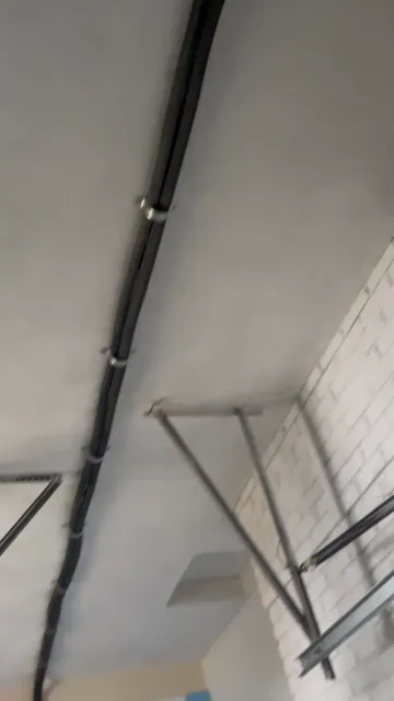 A clean line-set run along the ceiling