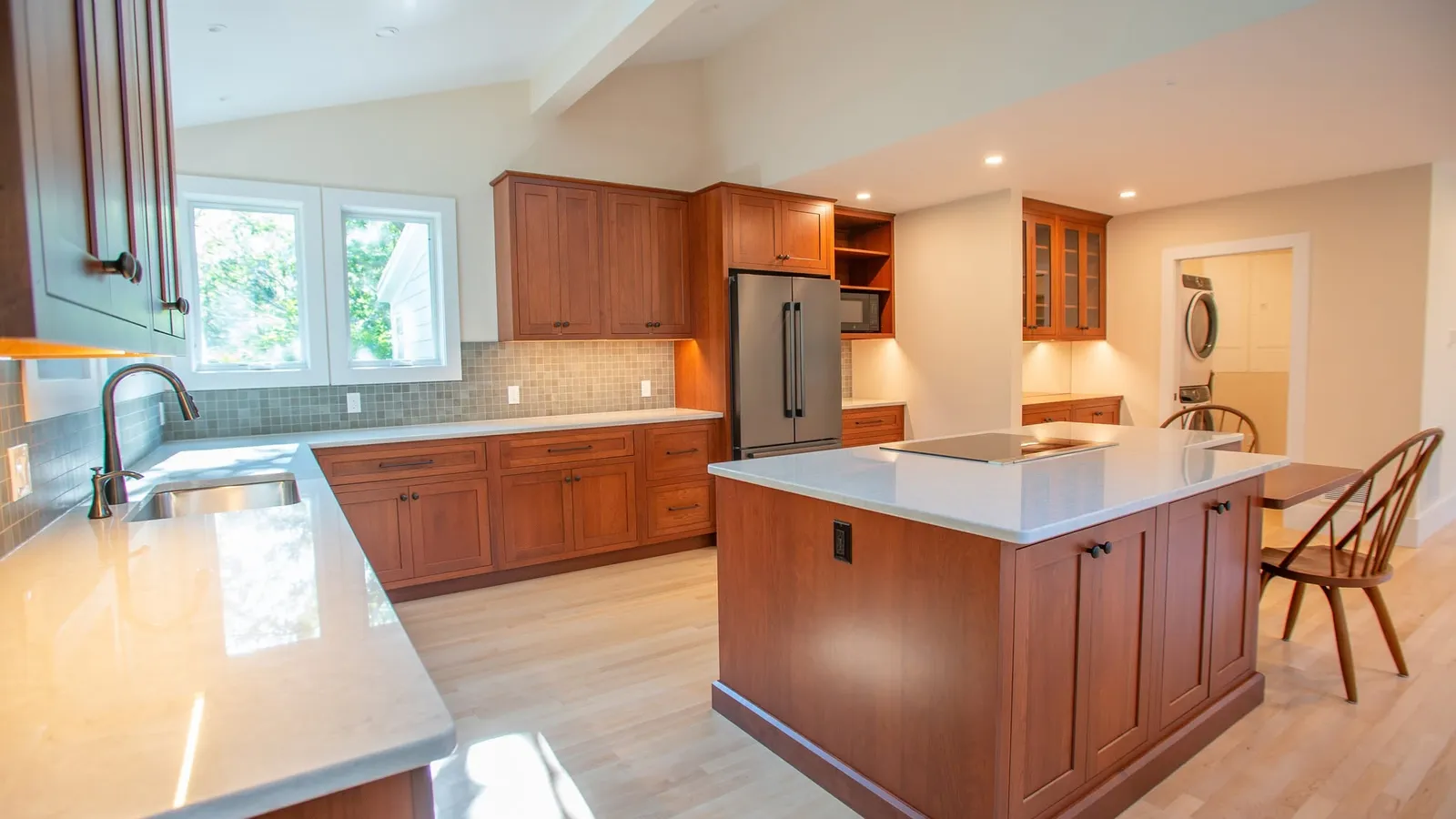 Cherry kitchen with quartz island and custom cabinetry