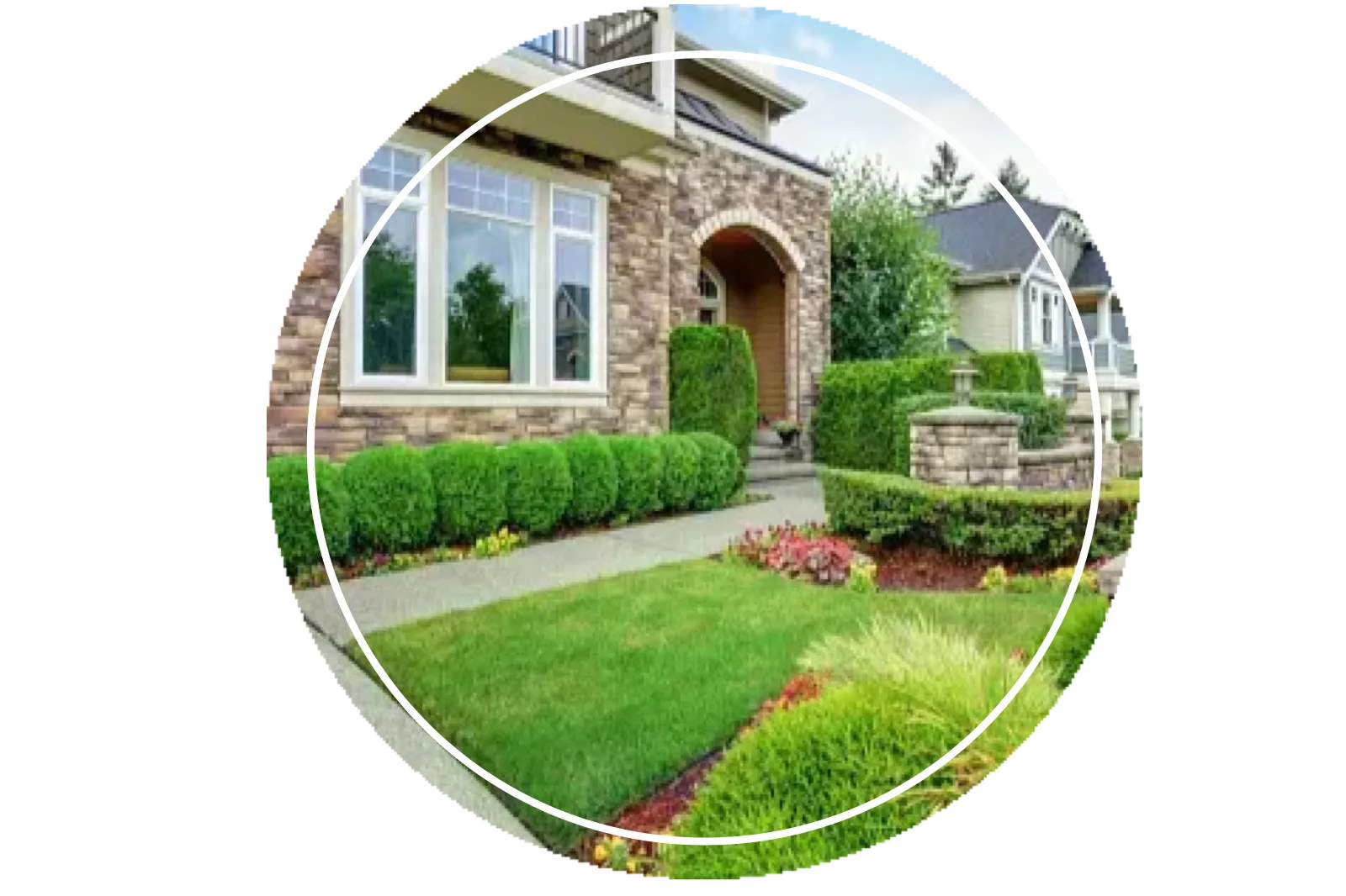 A picture of a house with bushes and flowers.
