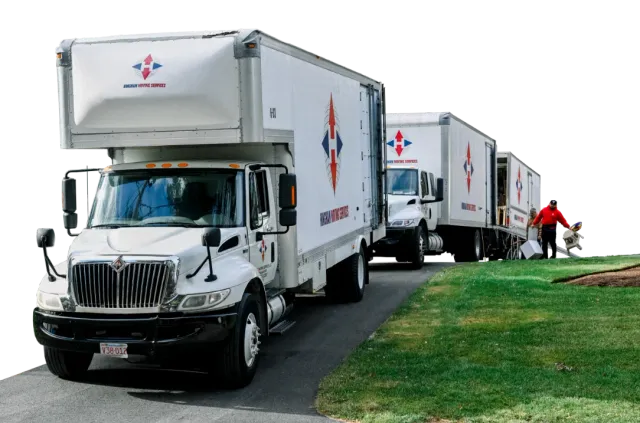 three Hingham Moving Services box trucks