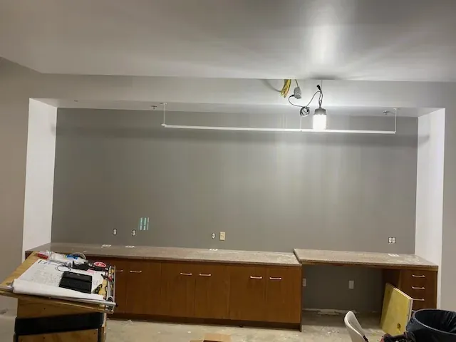 Commercial kitchen area painted gray during construction