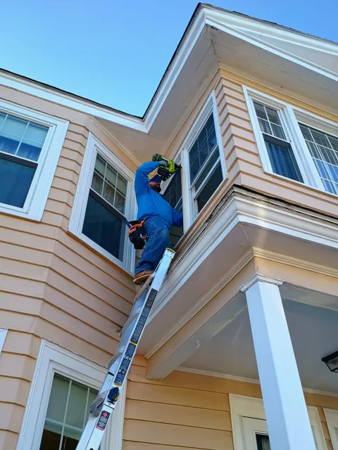 Task Masters Home Services working on exterior trim