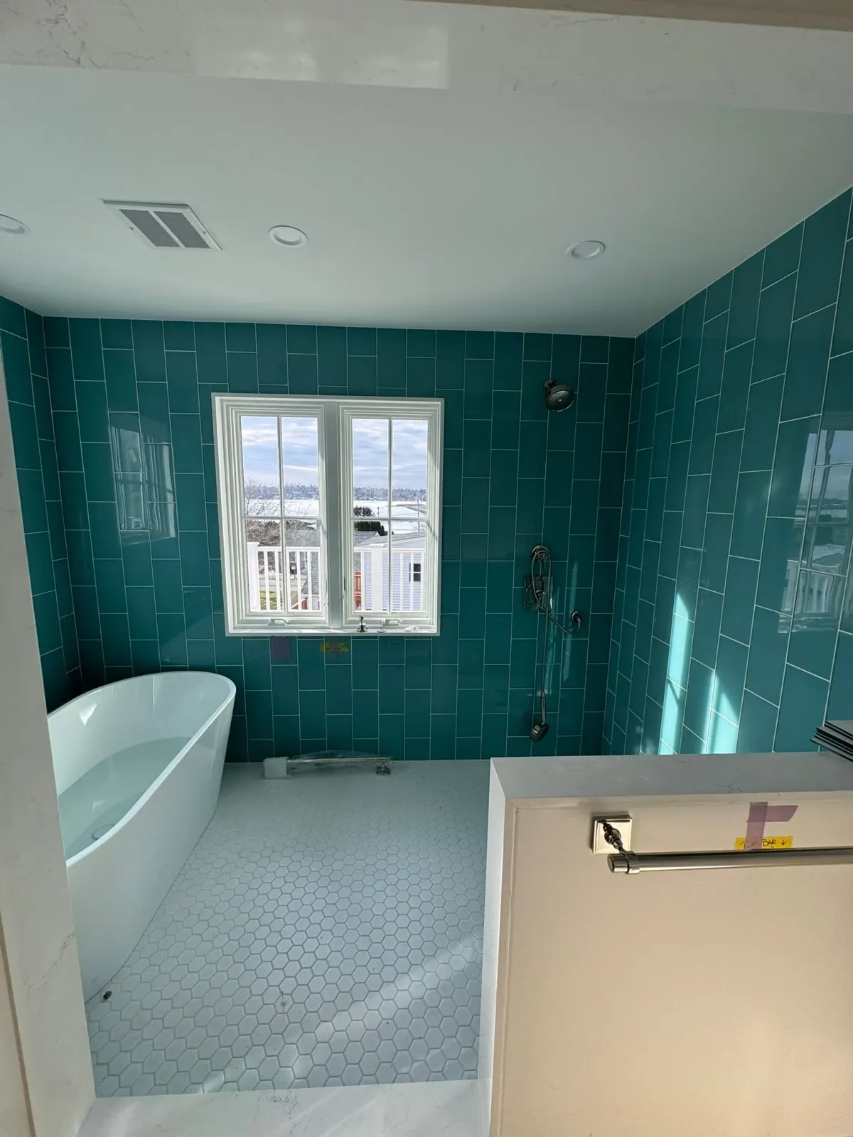 Teal tiled bathroom