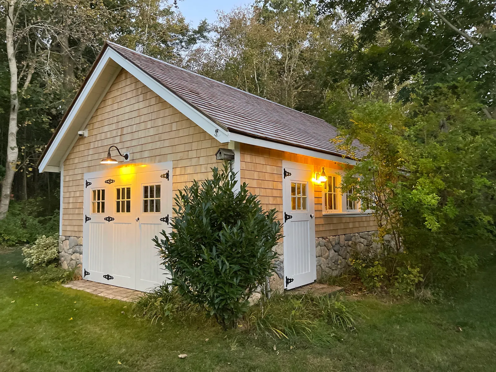 Garage remodel with new cedar shingle siding, roof and Azek trim in Orleans