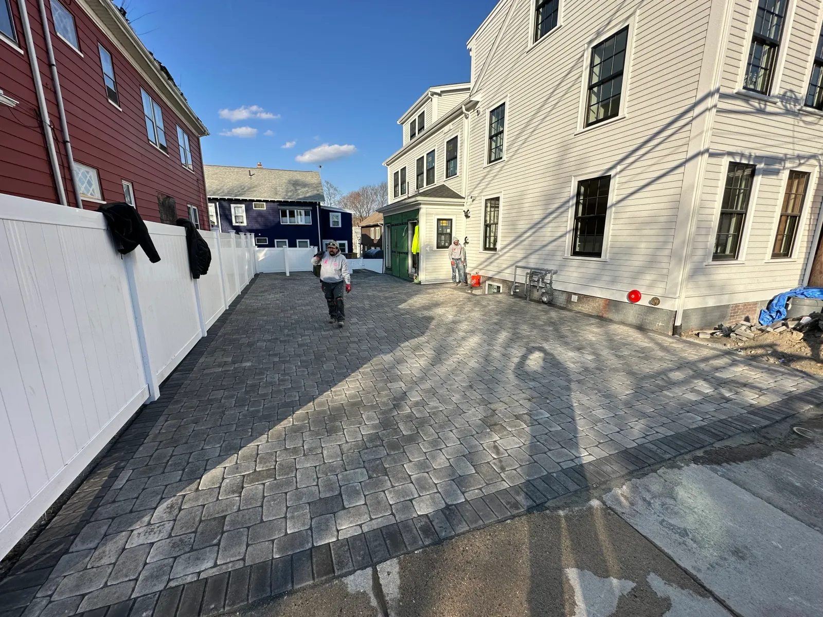 Paver driveway installed between two homes