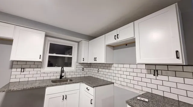 Kitchen finished — white shaker, subway tile