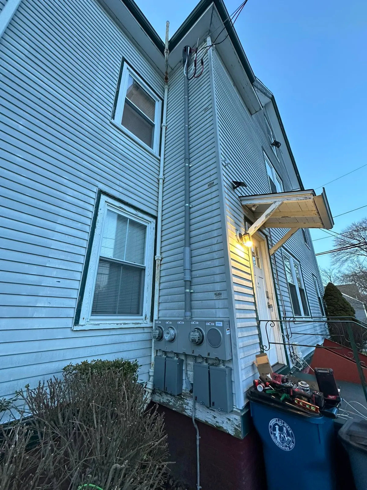New exterior meter bank and service disconnects on a multi-family home