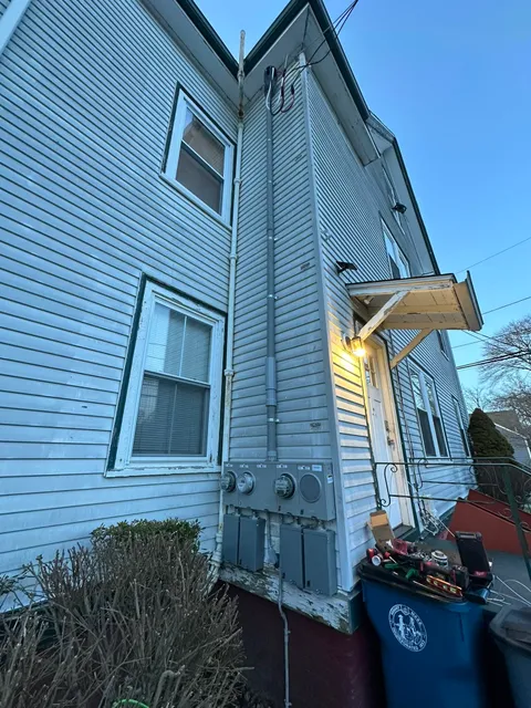 New exterior meter bank and service disconnects on a multi-family home