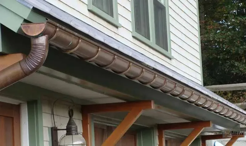 A house with a gutter on the side of it
