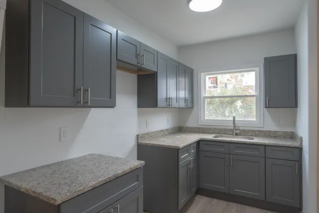 New gray shaker kitchen after full interior rebuild - Hemlock Street