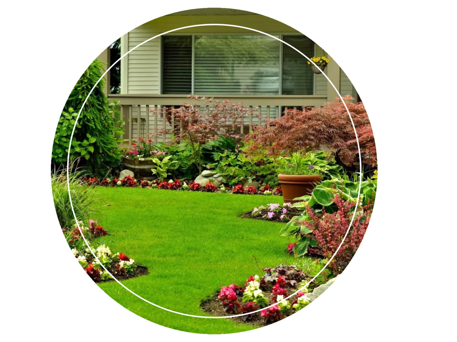 A garden with flowers and bushes in the middle of it.