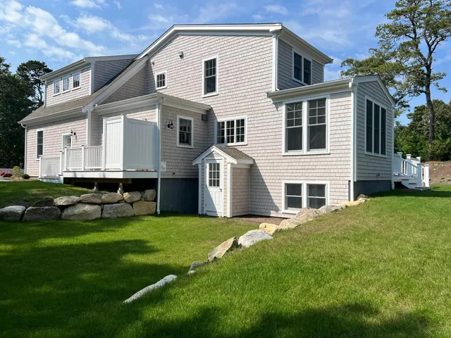 Exterior of a Cape Cod style home painted by HMS Painting