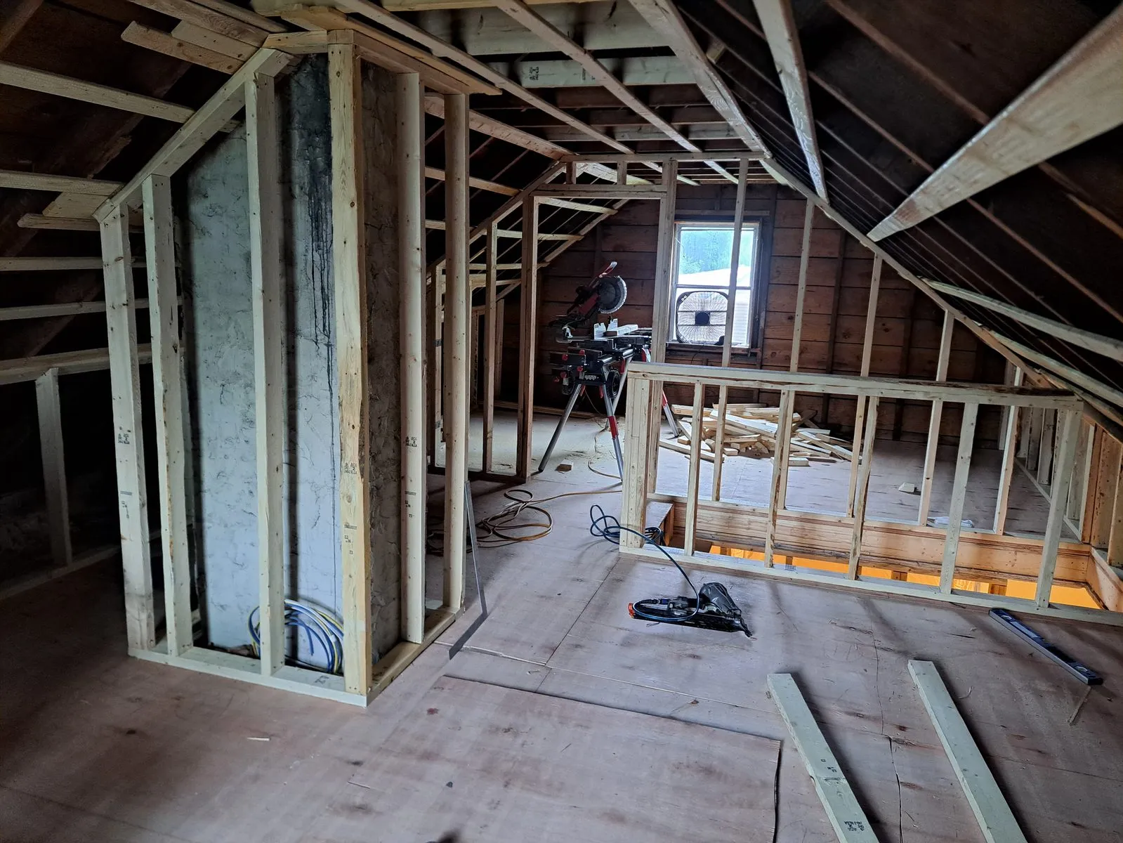 Before — attic wall studs during interior remodeling in Sutton, MA