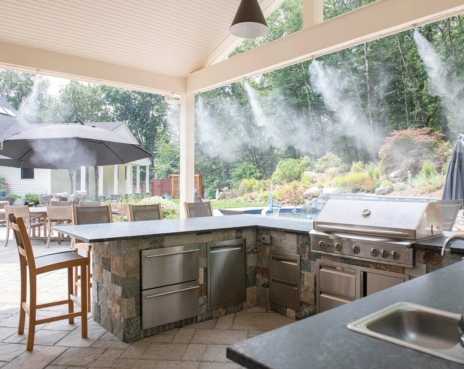 Nothing says July 4th weekend like firing up the grill and spending the day outside!

This custom outdoor kitchen is ready for burgers, BBQ, cold drinks, and a whole lot of time with family and friends. Integrated misters keep things cool and comfortable even on the hottest of afternoons, so you can actually enjoy being outside all day.  It's one of those spaces that makes you want to stay and relax long after dinner is over.

Here's to great food, great company, and making the most of summer. Happy Fourth of July weekend! 🎆

@jhs_landscape_const 

#OutdoorKitchen #BackyardLiving #OutdoorEntertaining  #LandscapeArchitect #AngieVergeLandscapeDesign