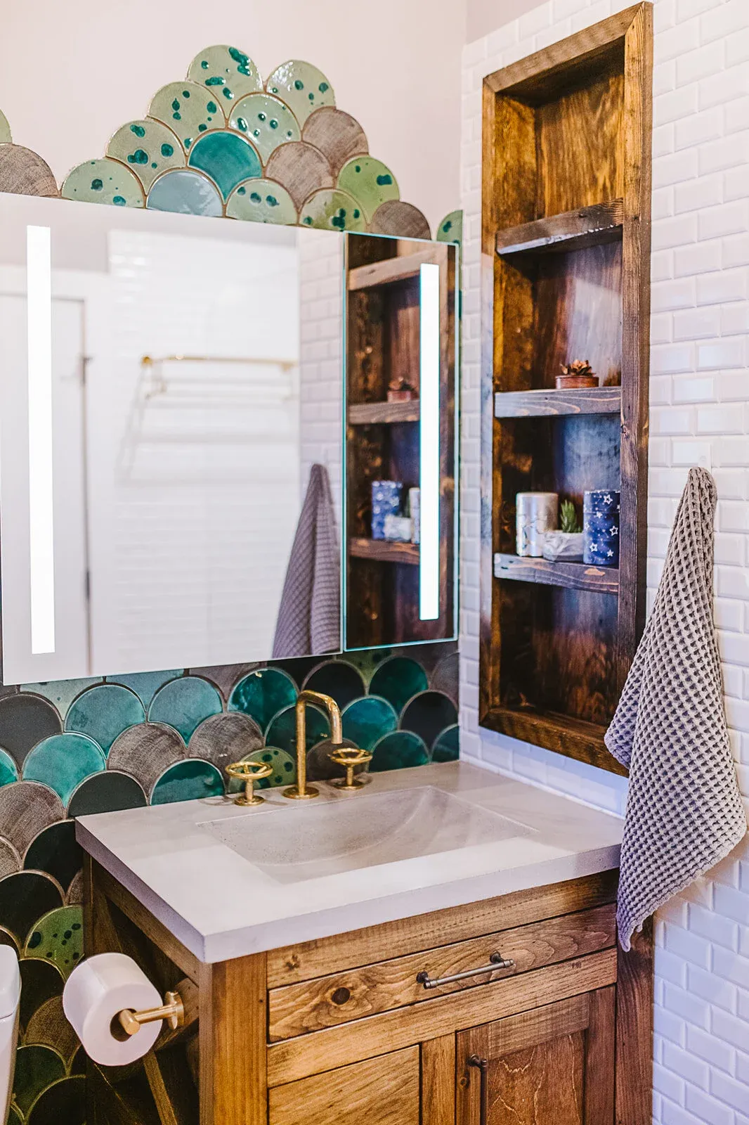 Jamaica Plain — Loft spa bathroom renovation. An uninspired stock bathroom transformed into this vibrant and luxurious full bath. Custom niche and shelving to fit the client’s bespoke hardware.